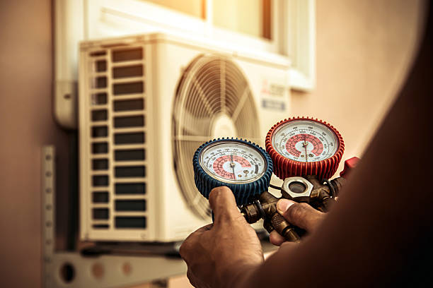 Professional Heat Pump Repair technician working in Woodville, OH